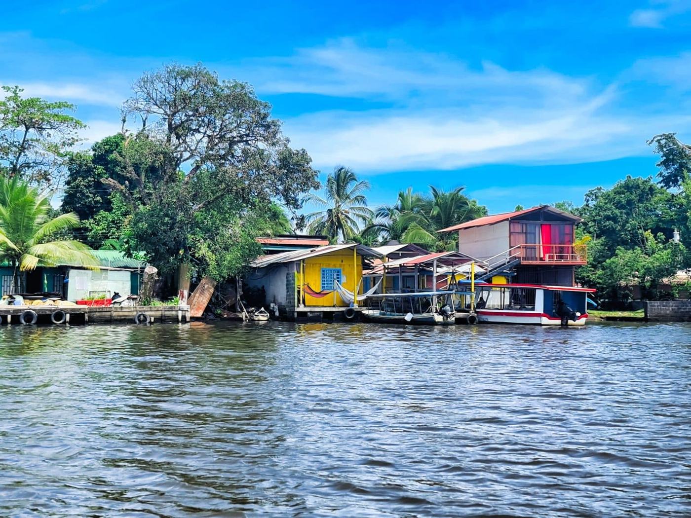 Colorful riverside houses in Tortuguero village