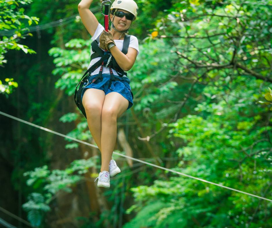 Guest ziplining through the Monteverde cloud forest canopy