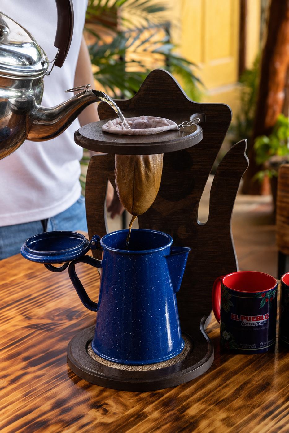 Traditional pour-over coffee brewing on a Monteverde coffee and chocolate tour